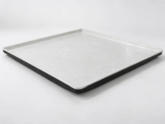 Shallow fiberglass bottom pan with a white interior and black underside