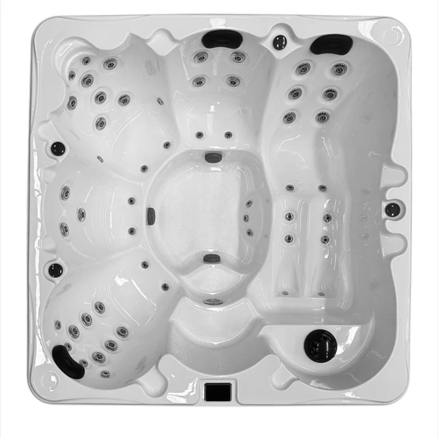 Original top-view photograph of the square white hot tub, showing the complete rim, seating, jets, headrests, and controls
